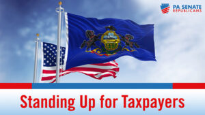 American flag flying behind the Pennsylvania flag with the words Standing Up for Taxpayers underneath